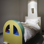 <p><strong><a href=ettore-sottsass.html class=link-lightbox>Ettore Sottsass</a></strong><br />Ruins</p><p><strong>Vegetazioni Sconosciute</strong><br />Single bed in plastic laminate with halogen light on the headboard.<br />100 x 235 x h. 225 cm.</p><p>Limited edition of 9 signed and numbered pieces and<br />3 artist’s proof.</p>